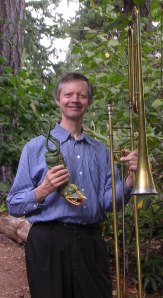 Phil Neuman holding the tartold and contrabass sackbutt